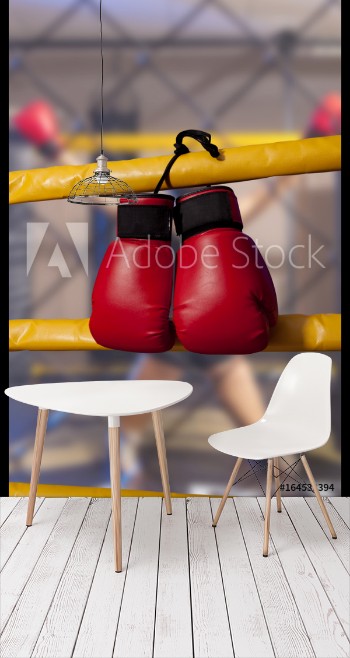 Bild på Red boxing gloves hangs off the boxing ring